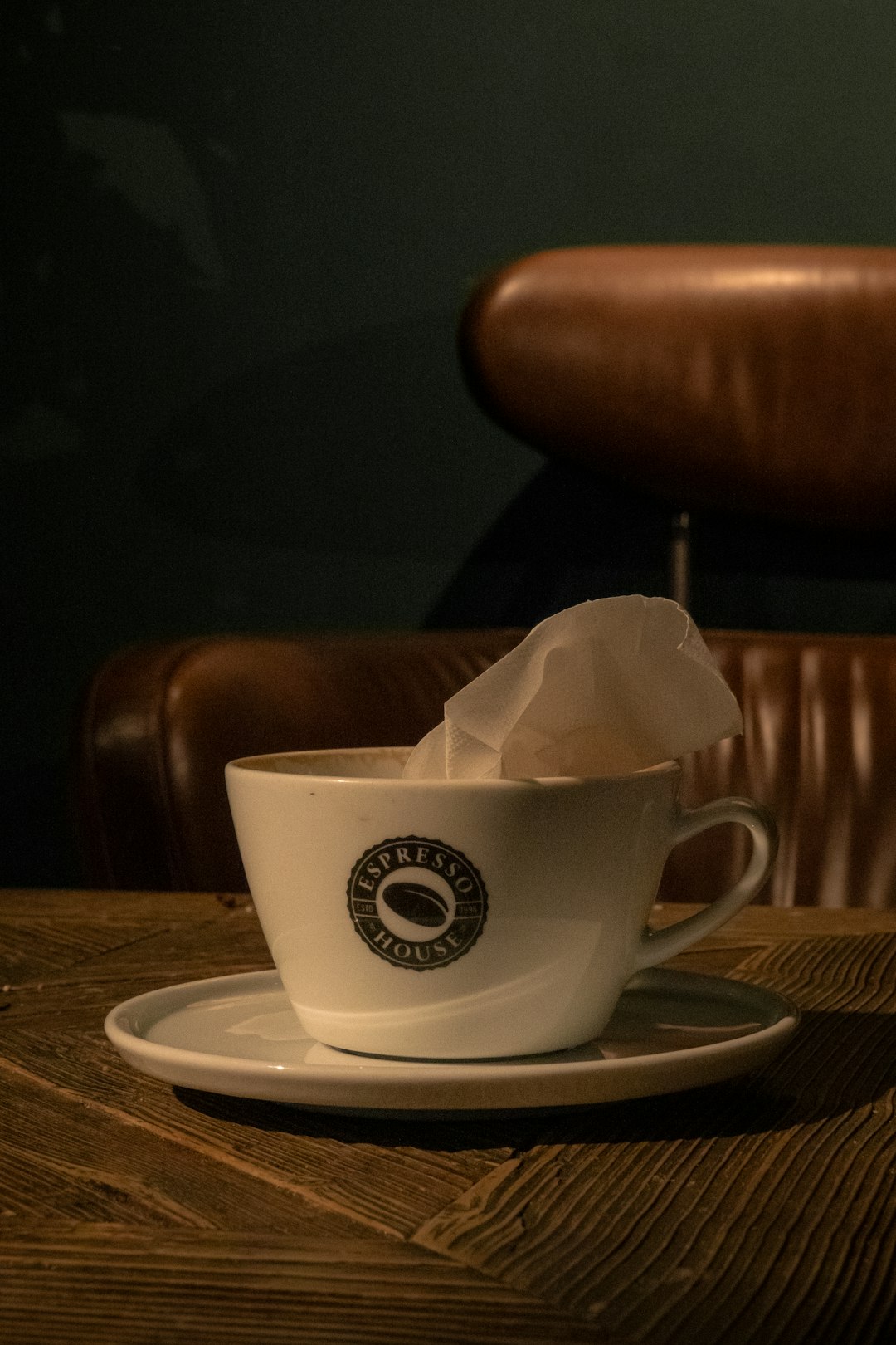 a-cup-of-coffee-on-a-saucer-on-a-wooden-table-2egkezr5bds