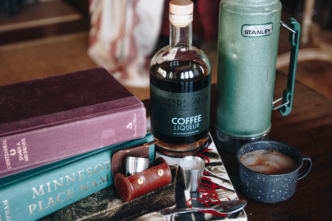a-bottle-of-coffee-sitting-on-top-of-a-table-pvfpz7sbimq